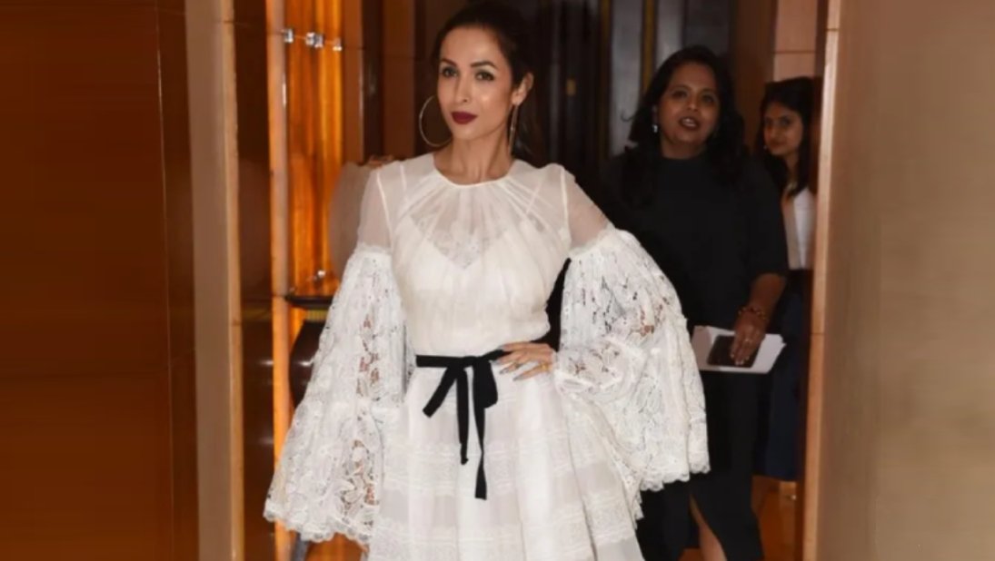 Malaika Arora keeps it simple yet beautiful in white top while taking photo. Here’s diva’s beautiful pic